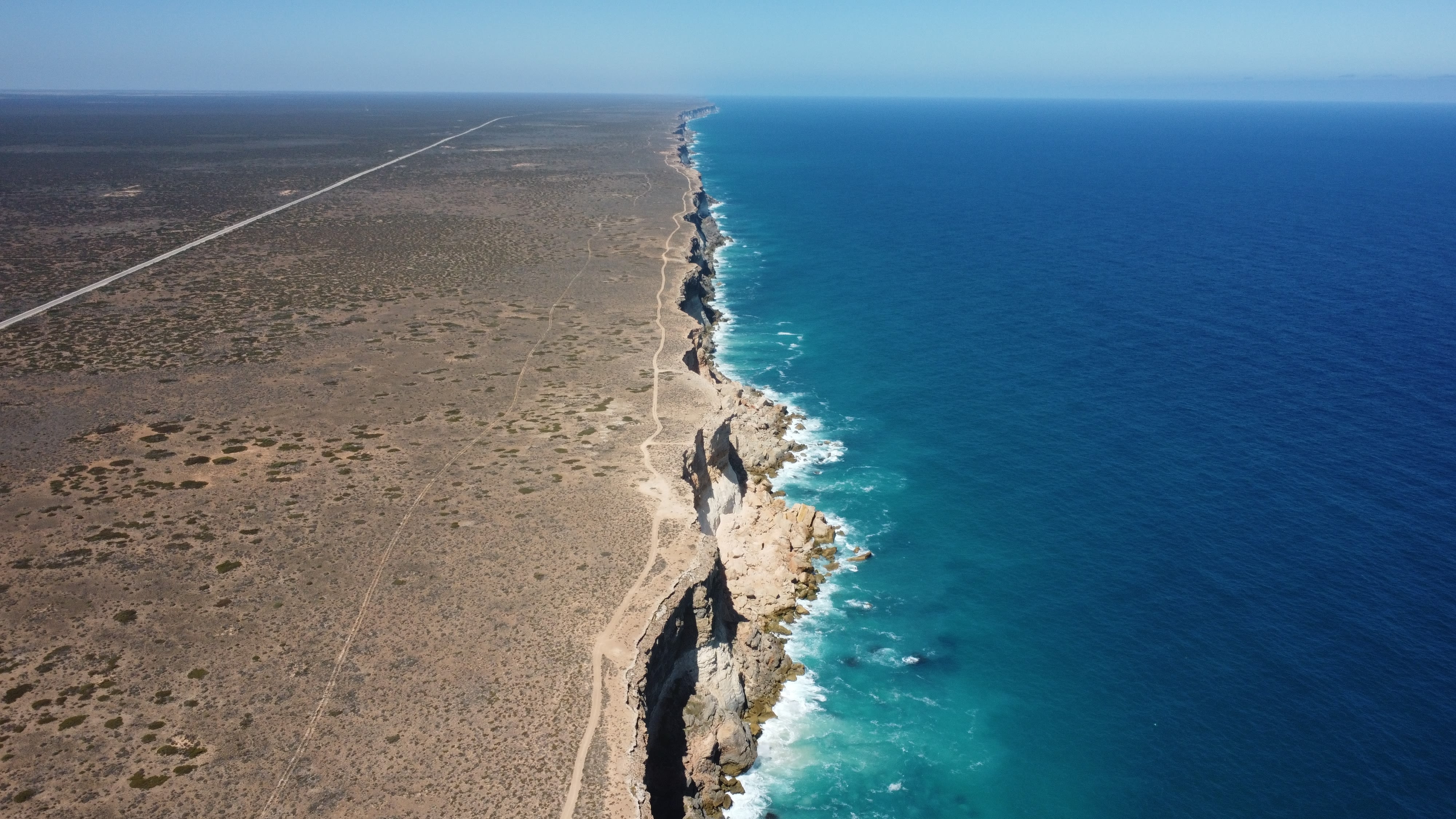 A picture of cliffs falling over the ocean.