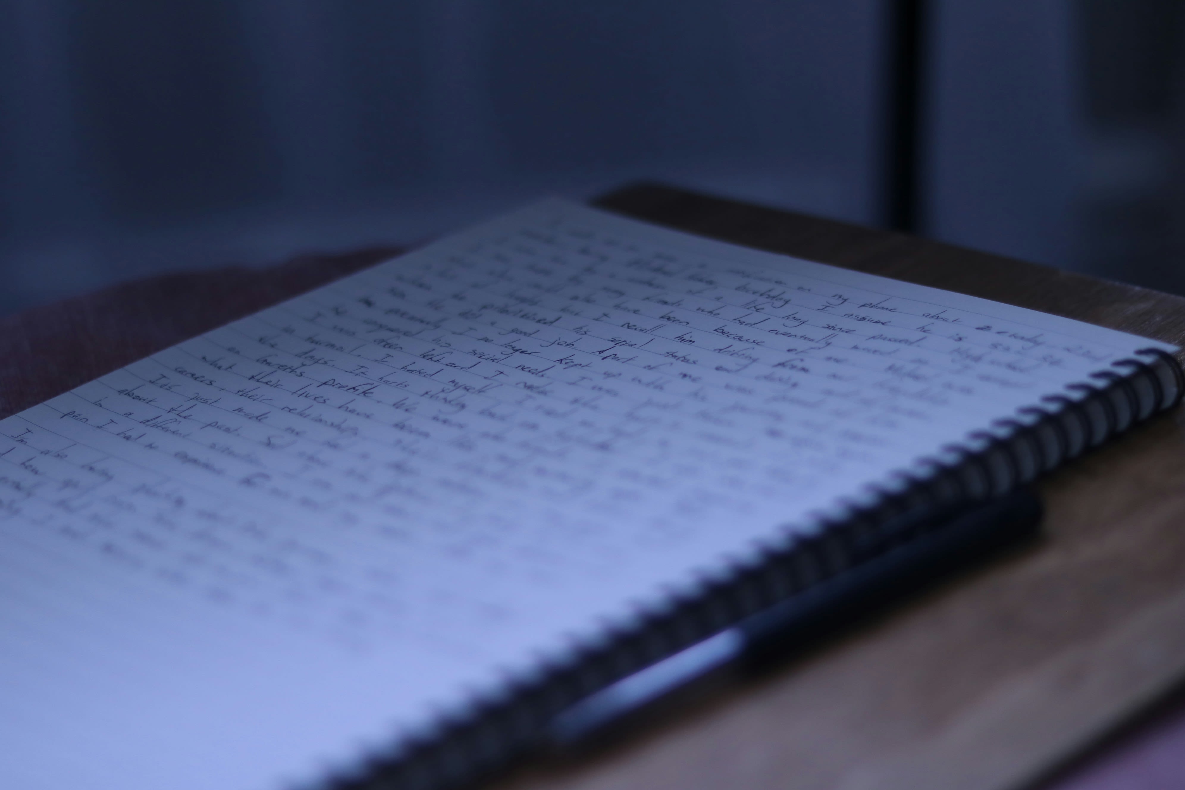 a notebook sitting on top of a wooden table