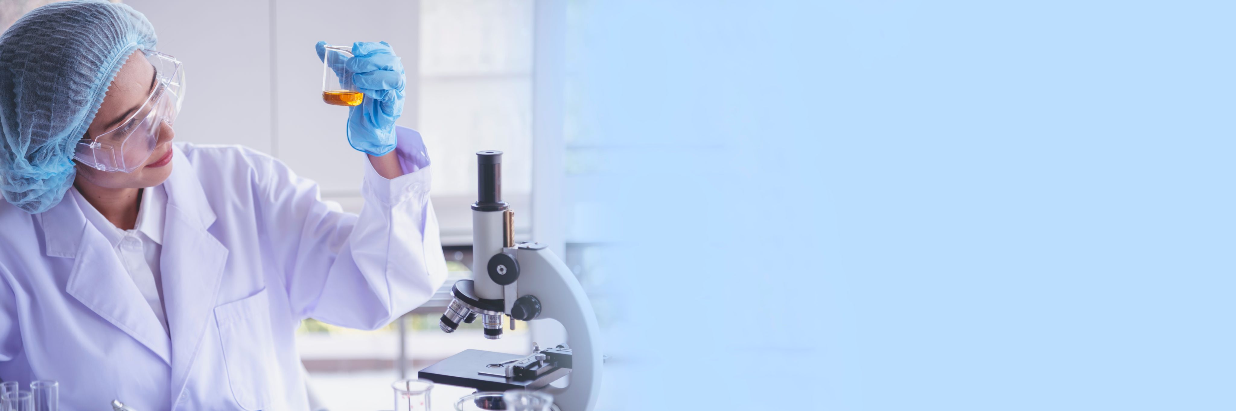 person in white long sleeve shirt holding green and white labeled can