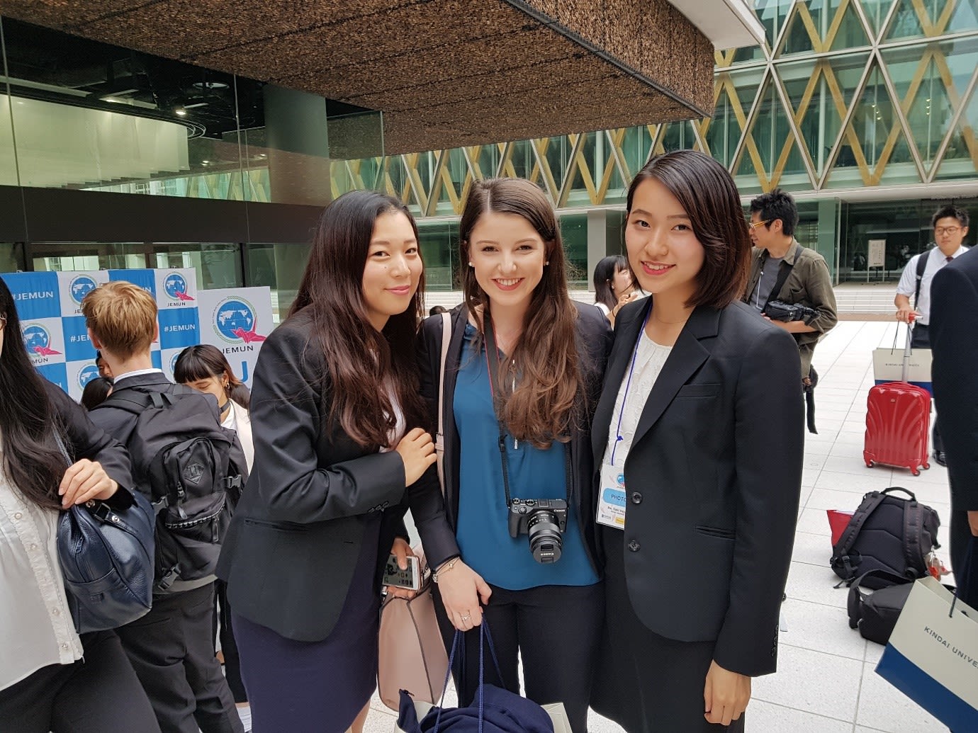 Three girls are smiling.