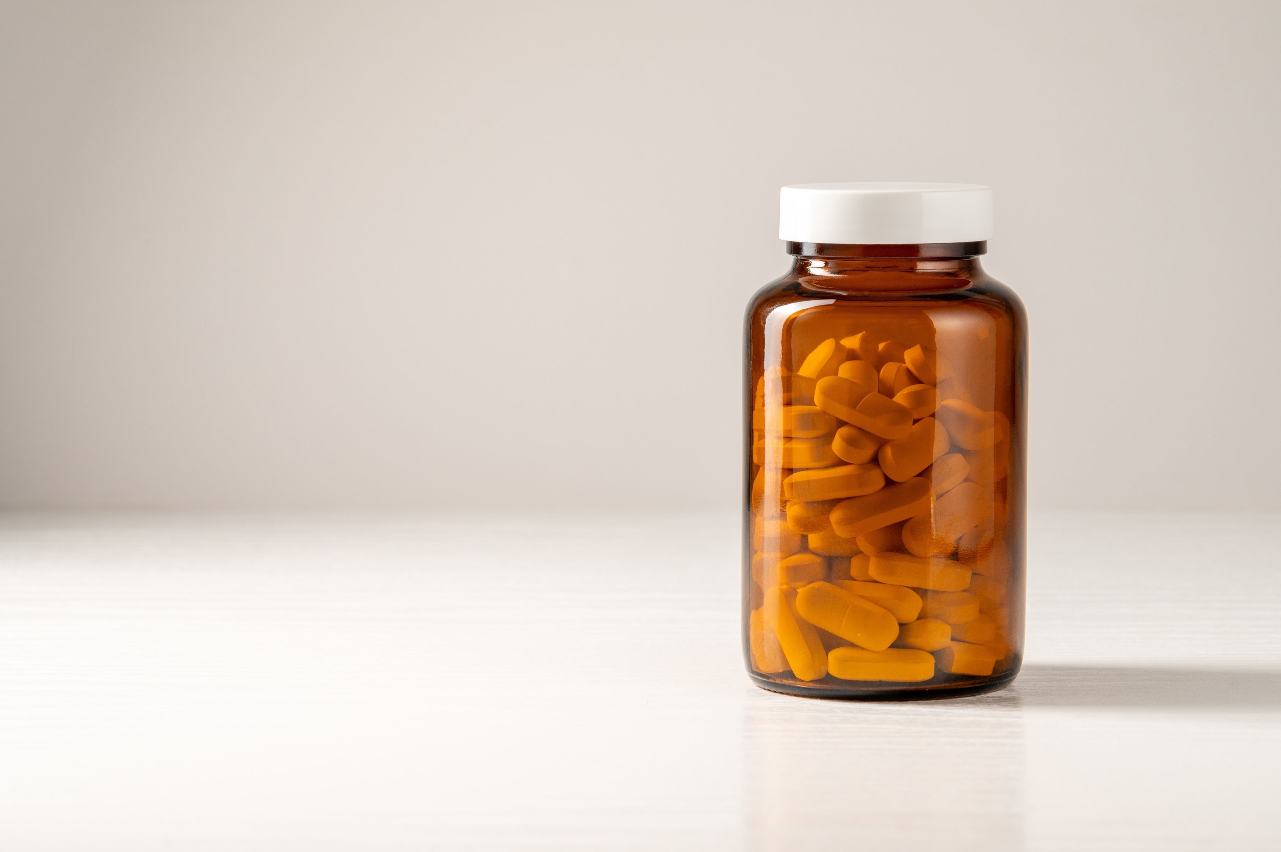 doctor holding red stethoscope