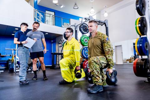 Men training in the gym as part of the Tactical Research Unit 
