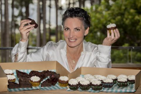 Rebecca Bennett holding her allergy free cakes