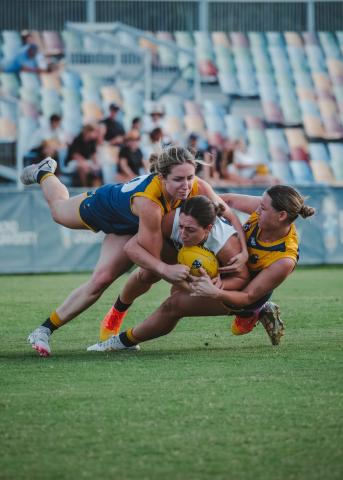 Paris Lightfoot tackles her opponent