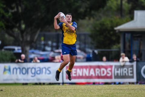 Tyler Campbell leaps for the ball.