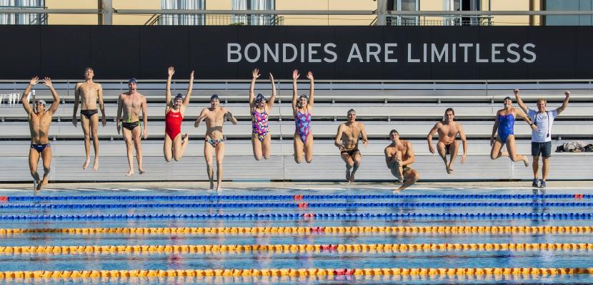 Bond swimmers jumping into the swimming pool