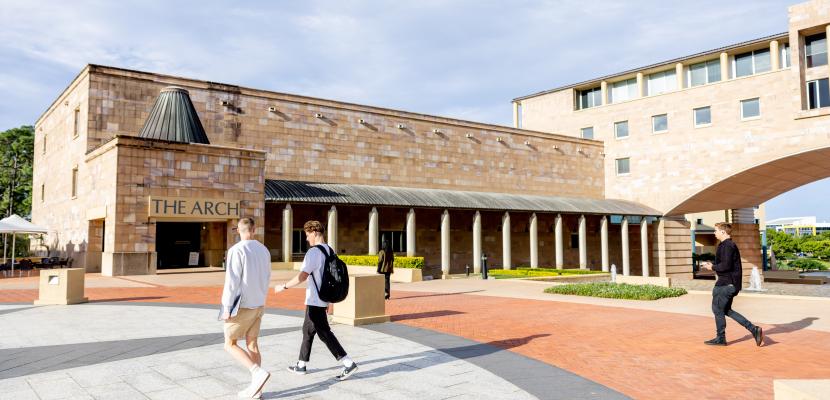 Students walking through the Quadrangle on a sunny day.