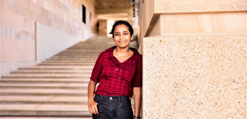 Pooja Jaiswal standing at the bottom of the Bond University thinking steps.