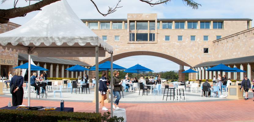 Blue tents set up under the arch for Open Day 2022