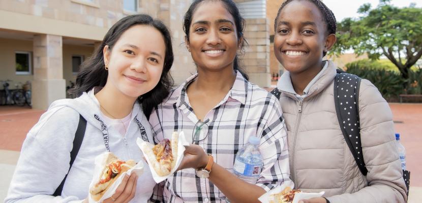 students at a sausage sizzle