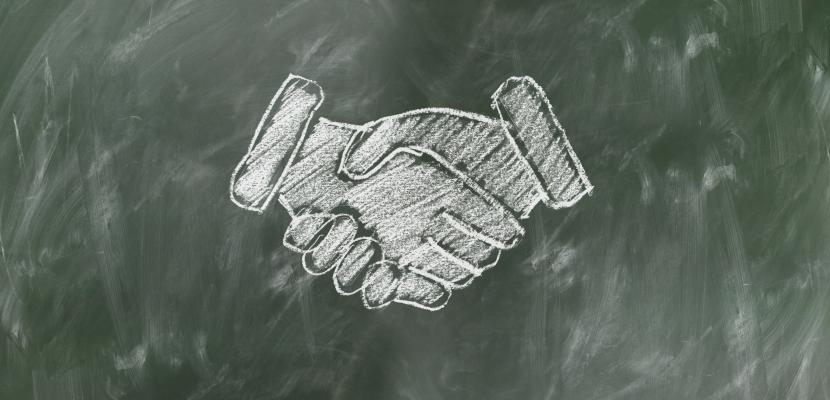 Chalk drawing of hands shaking