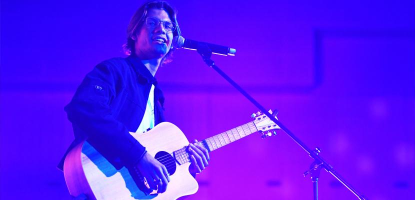 Artist plays guitar at the Indigenous Gala