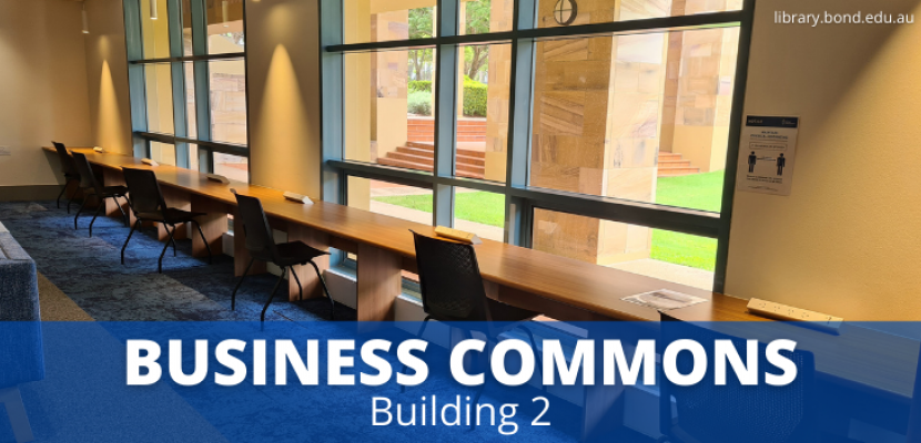 Chairs at a bench along a window. The bench has power outlets